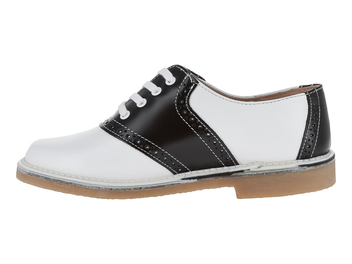 Zapato infantil marca Elefante en colores blanco y negro con cordones blancos y suela color café.