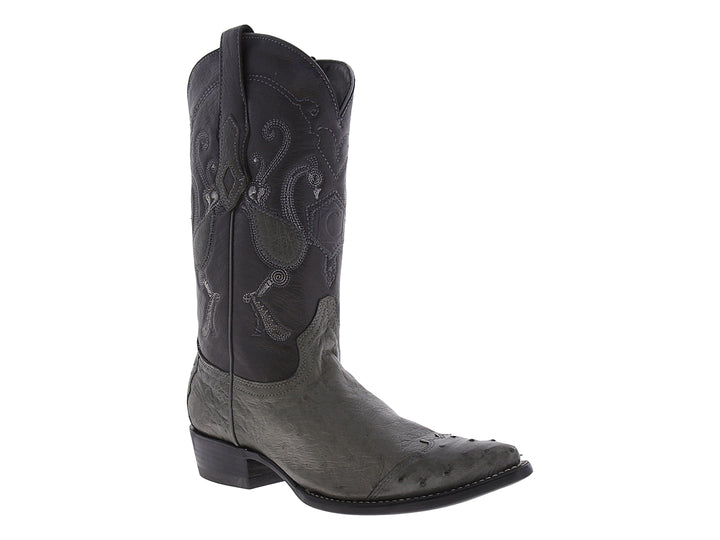 Bota vaquera de cuero color gris con bordados ornamentales en el tallo y punta afilada.