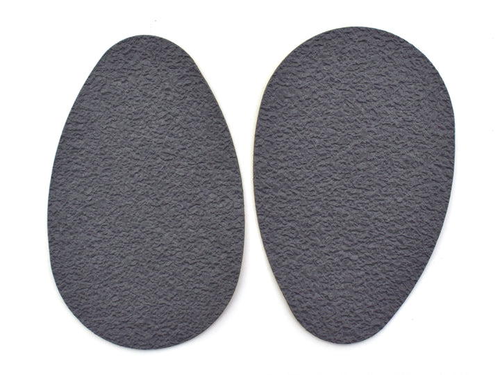 Suela antiderrapante Troy de color negro en empaque azul.