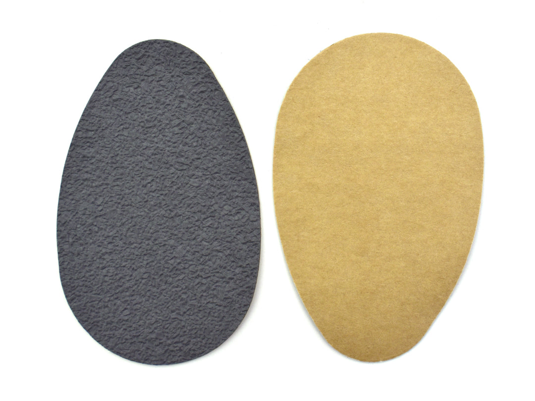 Suela antiderrapante Troy de color negro en empaque azul.
