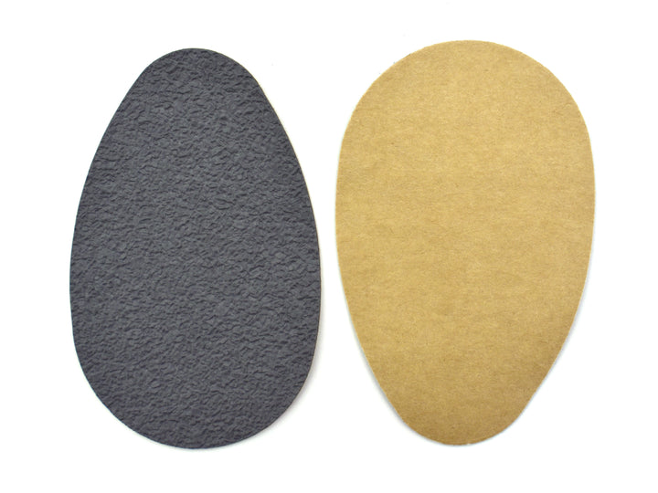Suela antiderrapante Troy de color negro en empaque azul.