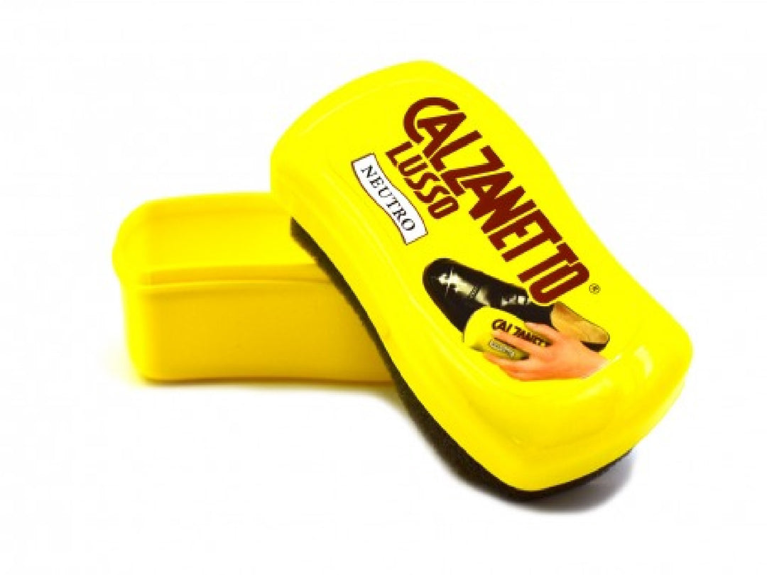 Esponja abrillantadora Calzanetto Lusso Neutro amarilla con su estuche protector de plástico.