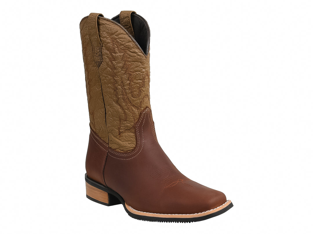Bota vaquera para niño en color marrón con tubo beige bordado y suela resistente.