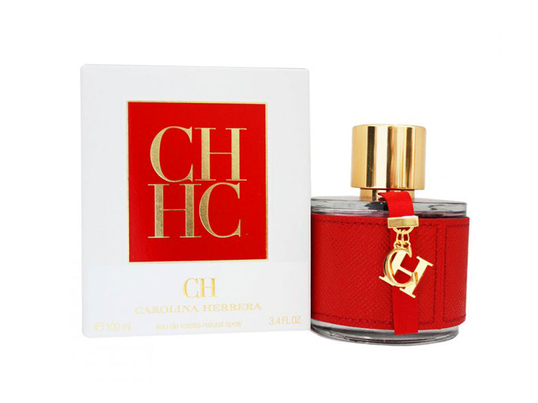 Perfume Carolina Herrera CH en botella con detalle de cuero rojo y tapa dorada, acompañada de su caja blanca.