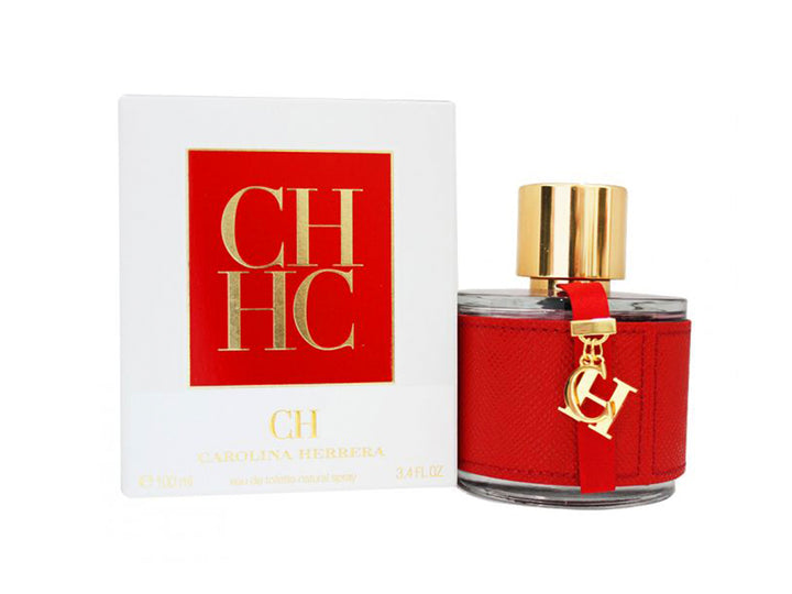 Perfume Carolina Herrera CH en botella con detalle de cuero rojo y tapa dorada, acompañada de su caja blanca.