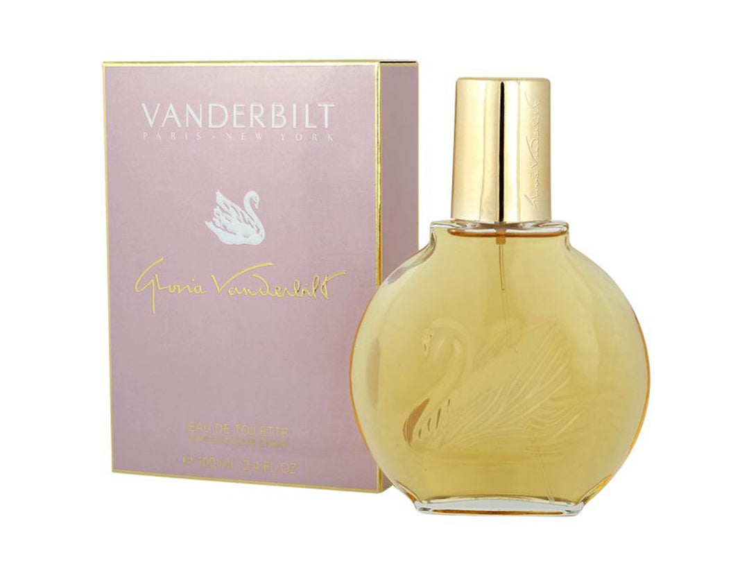 Frasco circular de perfume Gloria Vanderbilt con líquido dorado y su caja de color lila.