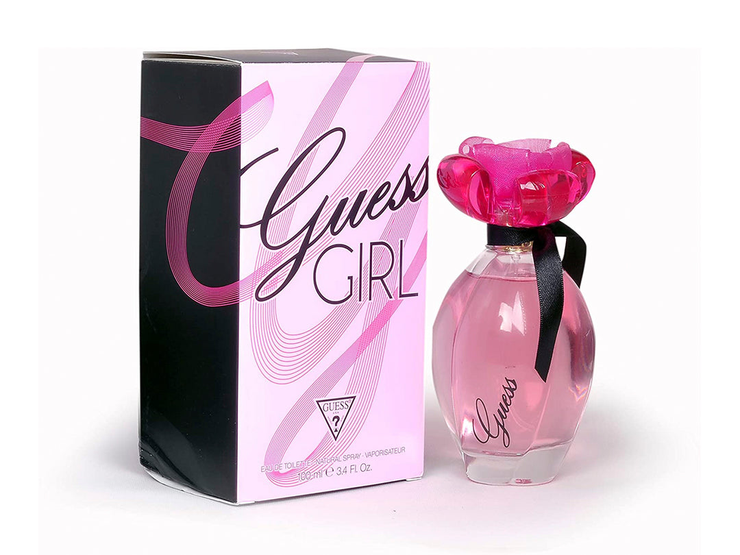 Perfume Guess Girl para mujer en botella rosa con tapa de flor y caja rosa y negra.