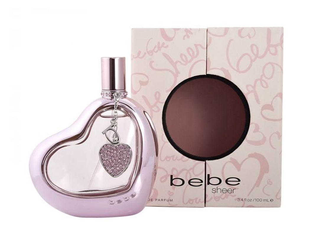 Perfume Bebe Sheer para mujer en botella con forma de corazón color lila junto a su caja.