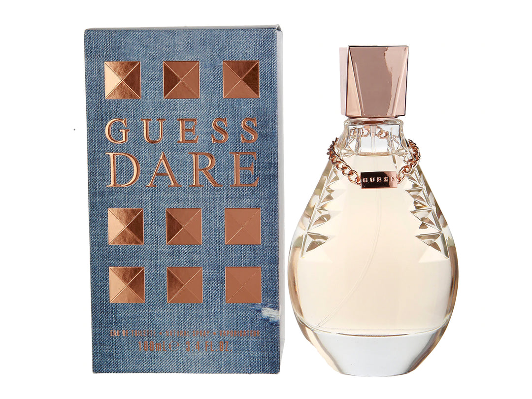 Perfume Guess Dare para mujer: botella de vidrio transparente y caja azul con detalles en color dorado.