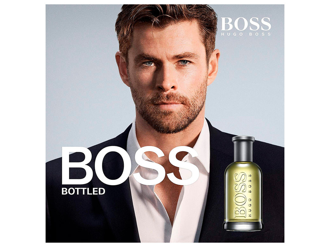 Perfume Hugo Boss Bottled en botella de vidrio con líquido amarillo y su caja plateada