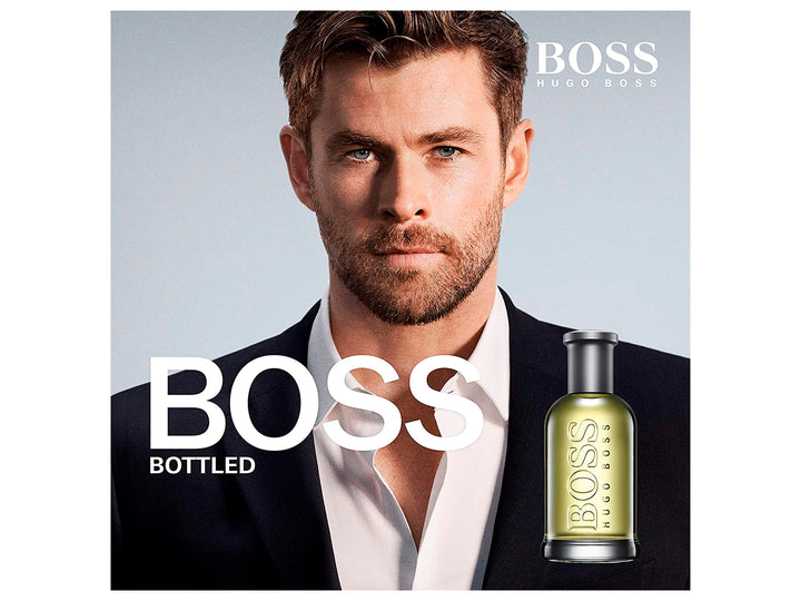 Perfume Hugo Boss Bottled en botella de vidrio con líquido amarillo y su caja plateada