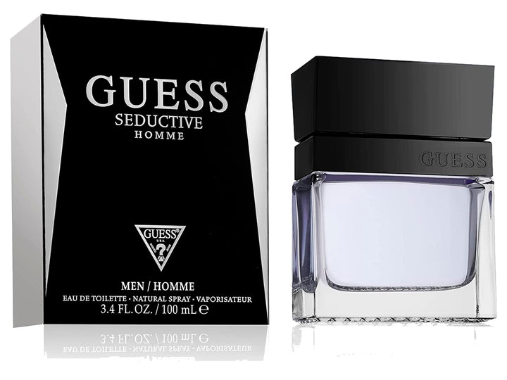 Perfume Guess Seductive Homme con su caja negra y botella de vidrio transparente con tapa negra.