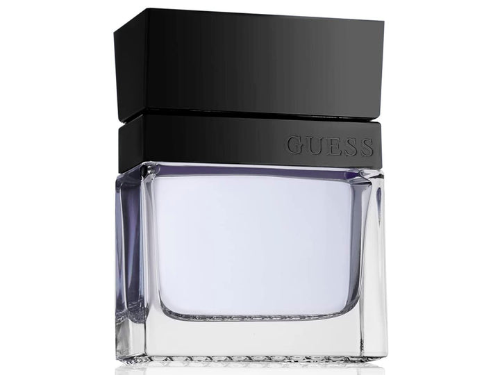 Perfume Guess Seductive Homme con su caja negra y botella de vidrio transparente con tapa negra.