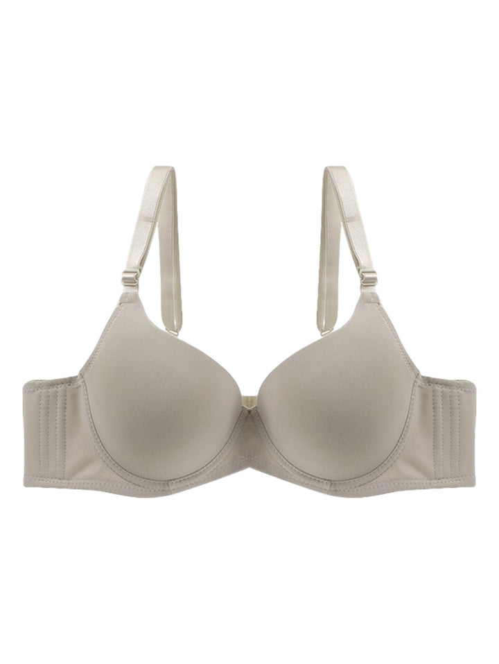 Brasier color beige para mujer con copas lisas y tirantes ajustables.