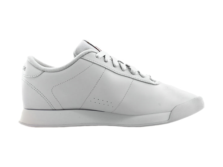 Tenis deportivos Reebok de color blanco, vista lateral.