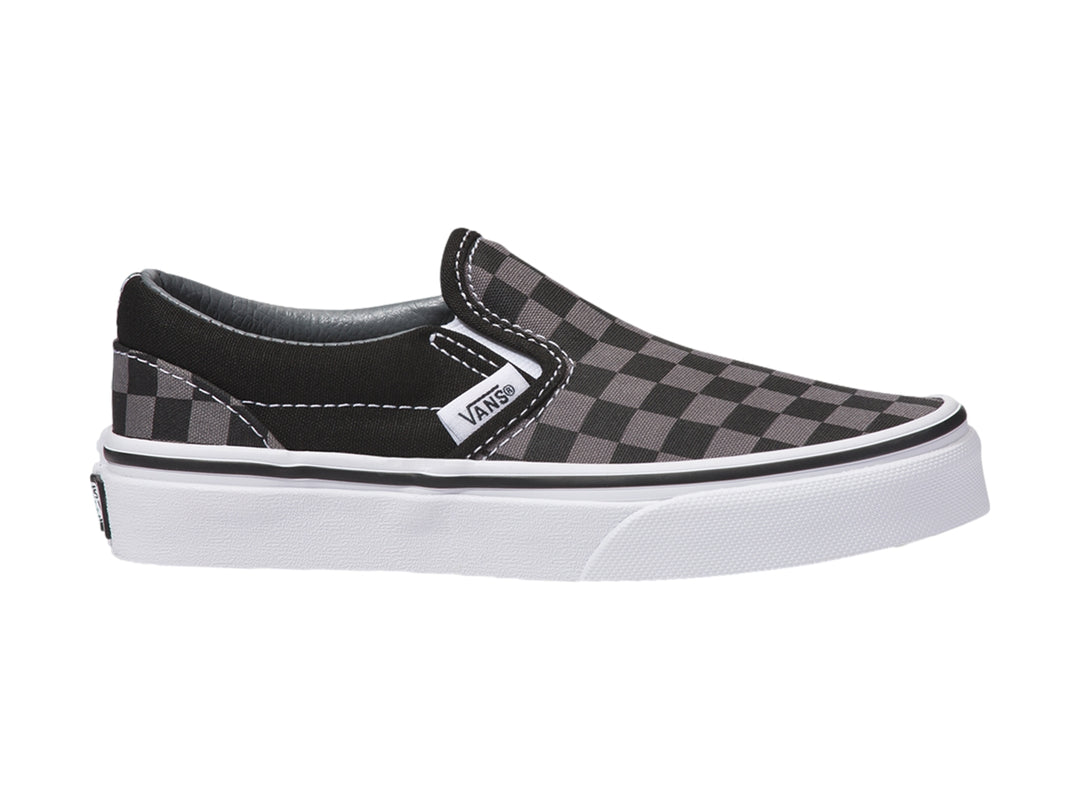 Tenis Vans Classic Slip-On para niño con diseño de cuadros en color negro y gris con suela blanca.