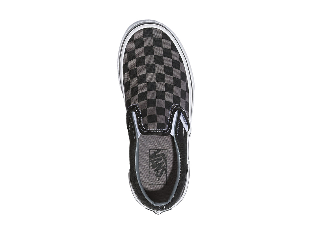 Tenis Vans Classic Slip-On para niño con diseño de cuadros en color negro y gris con suela blanca.