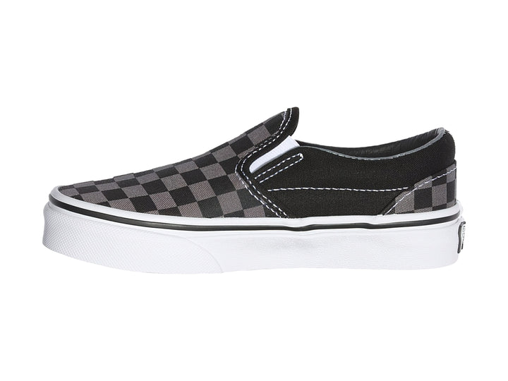 Tenis Vans Classic Slip-On para niño con diseño de cuadros en color negro y gris con suela blanca.