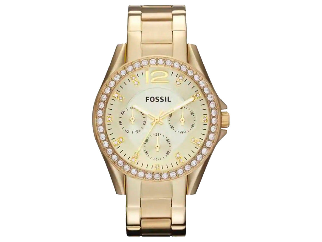Reloj Fossil dorado con bisel decorado con cristales y correa de eslabones metálicos.