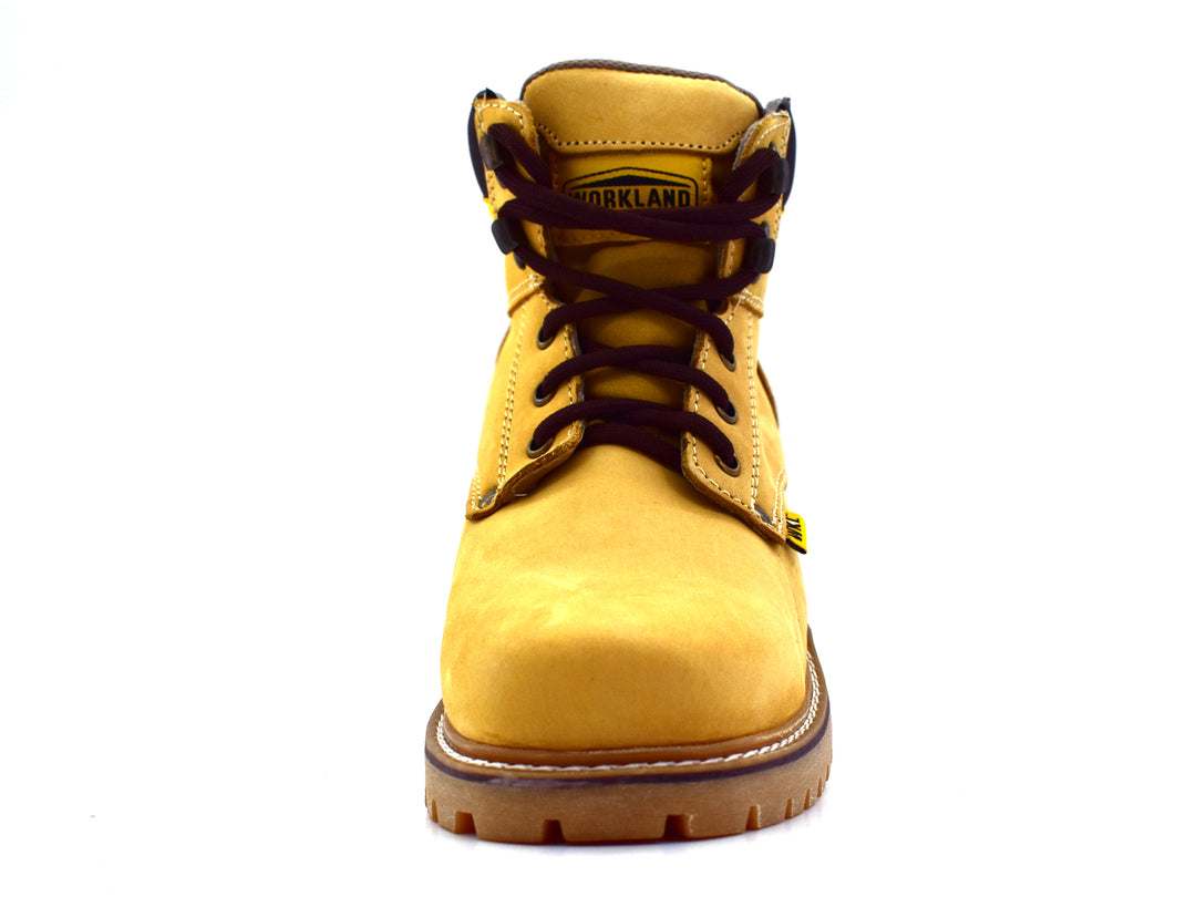 Bota de cuero nobuck color miel con agujetas cafés y suela robusta para niño.