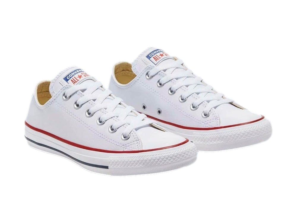 Tenis Converse Chuck Taylor All Star Ox en color blanco con detalles rojos y azules en la suela.