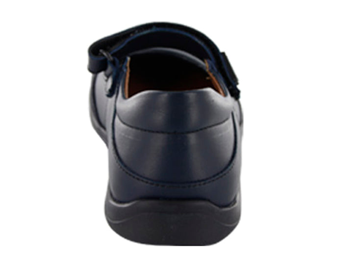 Zapato infantil color azul marino con correa ajustable y suela negra.