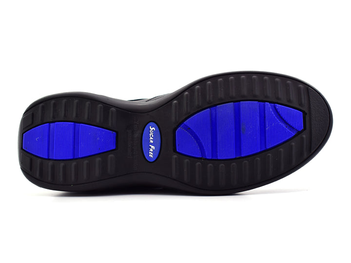 Zapato casual JARKING color negro con detalles perforados y suela con cámara de aire visible.