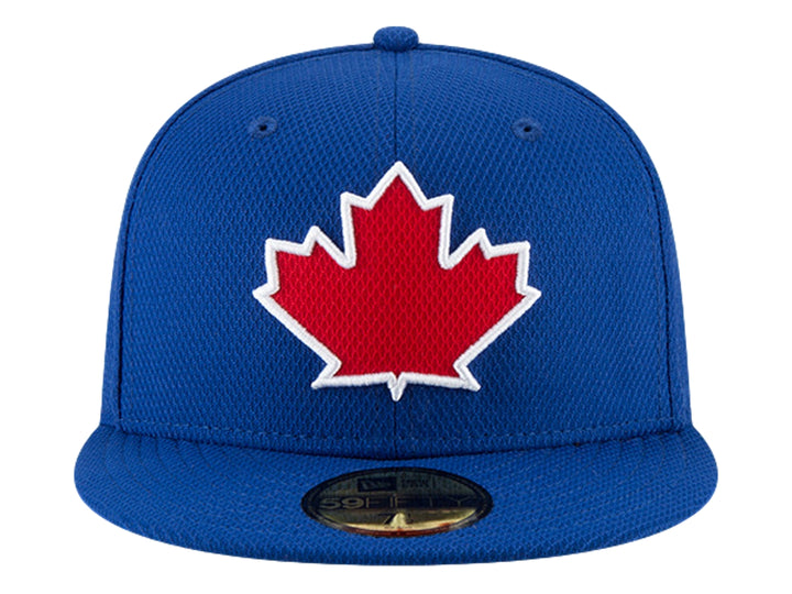 Gorra New Era azul con visera plana y hoja de maple roja bordada al frente.