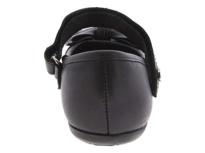 Zapato negro para niña marca Coqueta, estilo Mary Jane con moño decorativo y correa con botón.