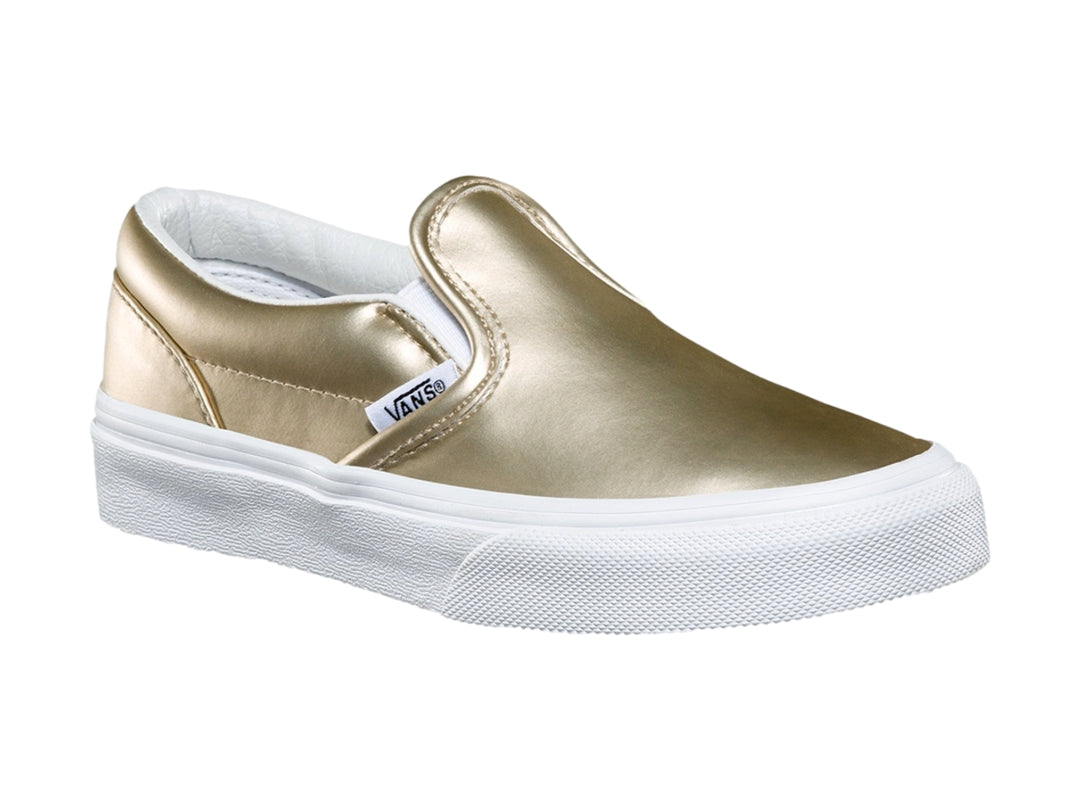 Zapato Vans slip-on para niño en color dorado metálico con suela blanca clásica.