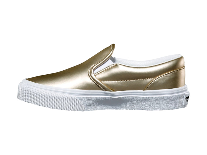 Zapato Vans slip-on para niño en color dorado metálico con suela blanca clásica.