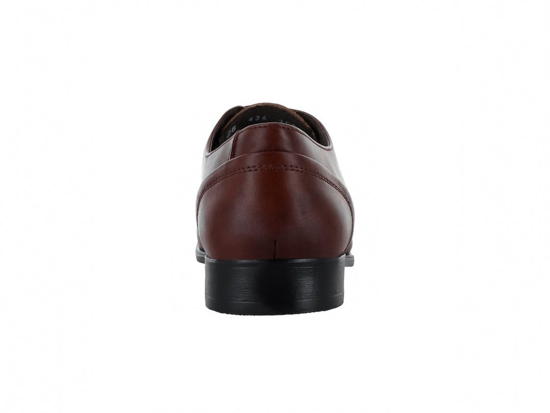 Zapato formal Oxford color miel para hombre con textura granulada y suela negra.