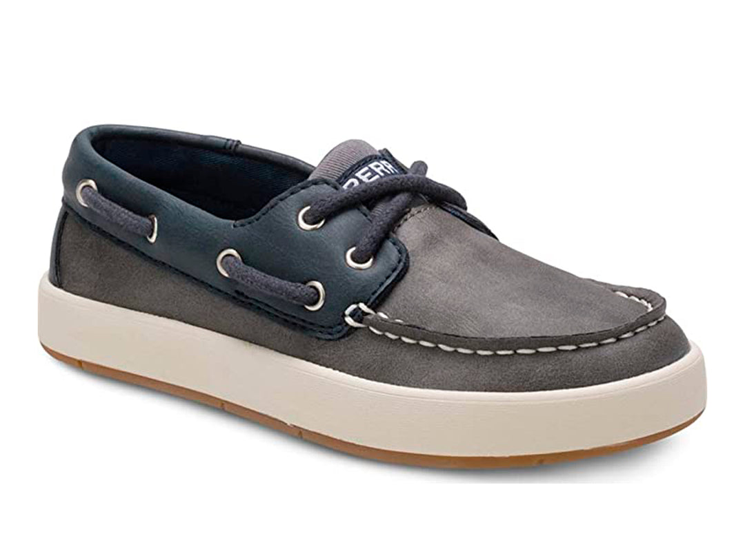 Zapato náutico infantil Sperry color azul marino y gris con suela blanca.