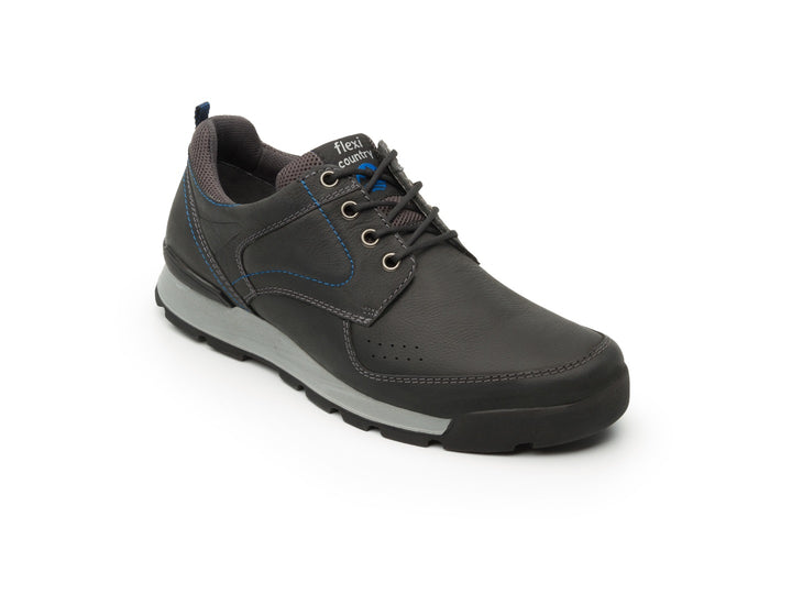 Botas Flexi Hercules Country para hombre en color negro con suela gris y detalles en azul.