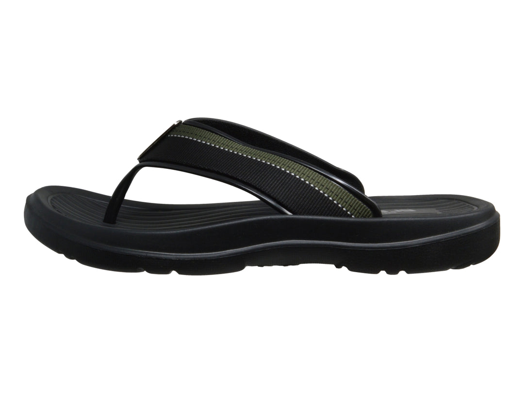 Sandalias deportivas ELEGA en color negro con detalles en verde y suela texturizada.