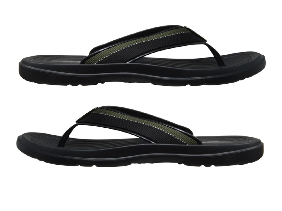 Sandalias deportivas ELEGA en color negro con detalles en verde y suela texturizada.