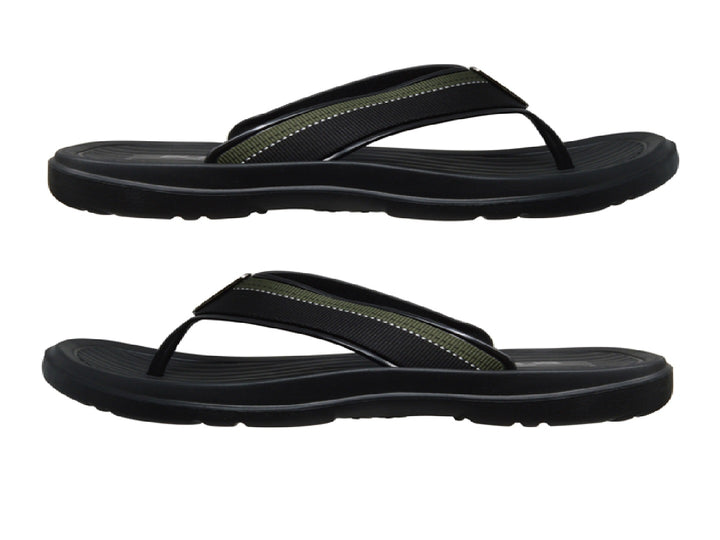 Sandalias deportivas ELEGA en color negro con detalles en verde y suela texturizada.
