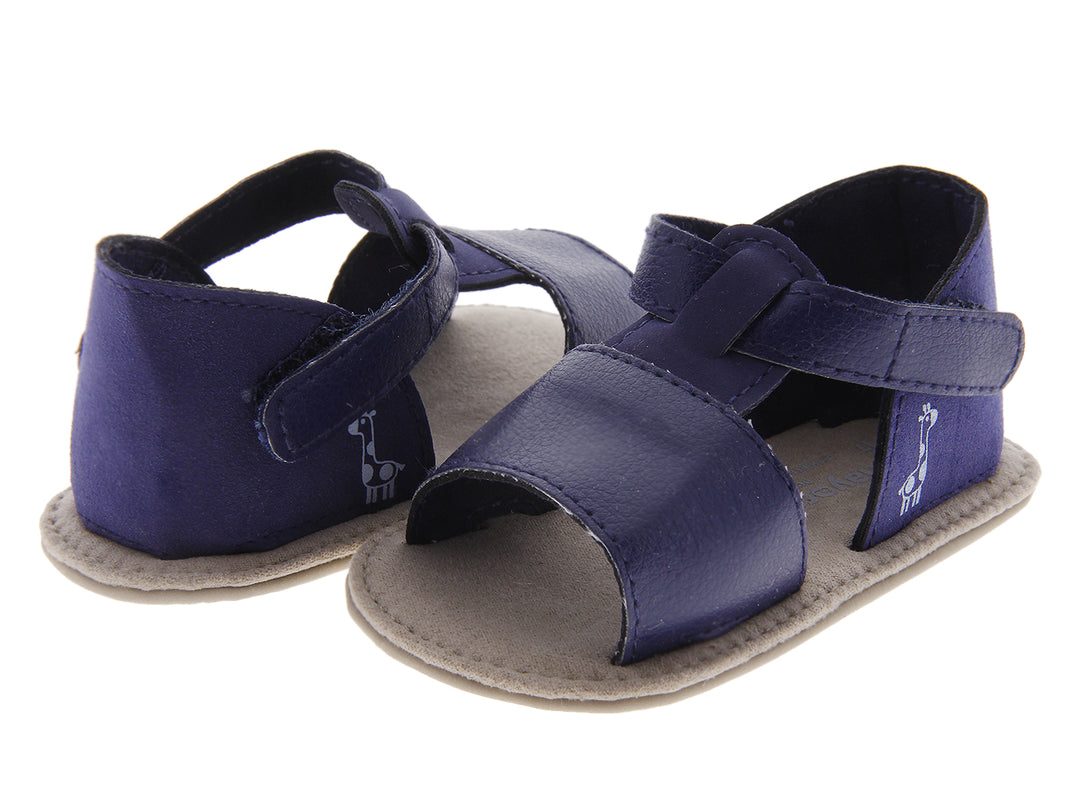 Sandalias para bebé color azul marino con suela gris y cierres ajustables.