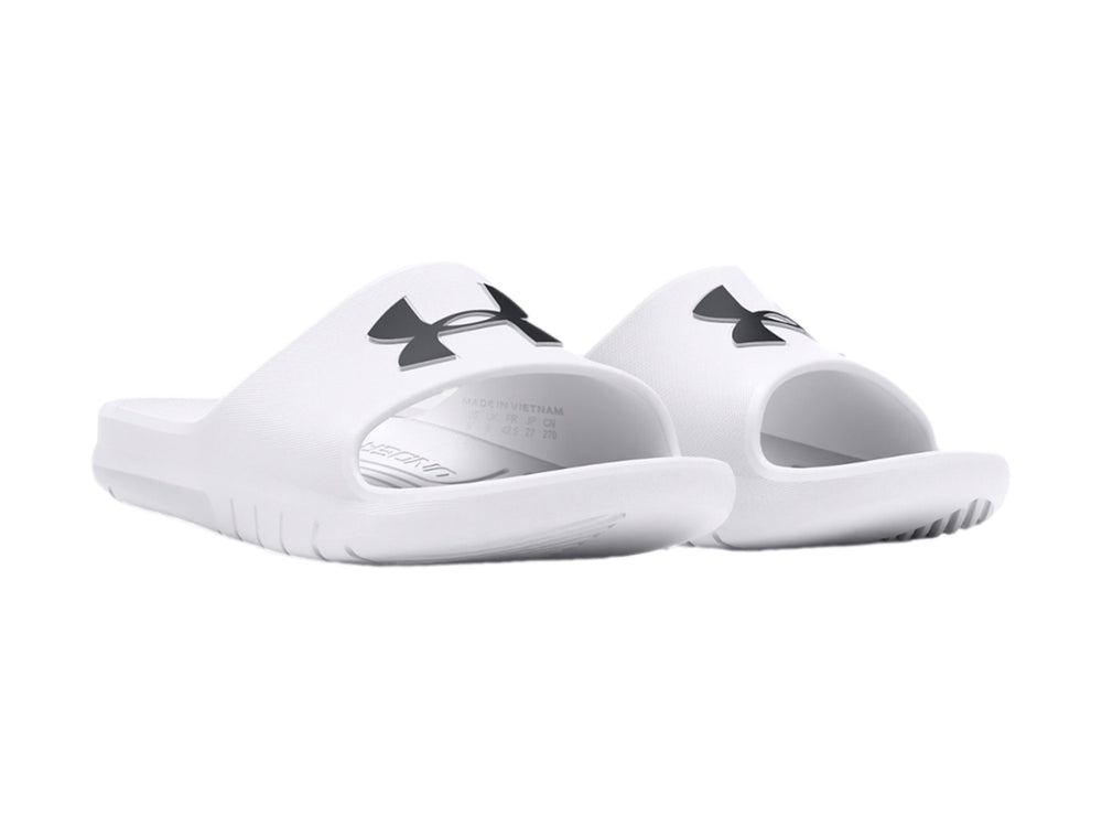 Sandalia Under Armour de color blanco con logo negro en la parte superior, diseño deportivo y suela ancha.