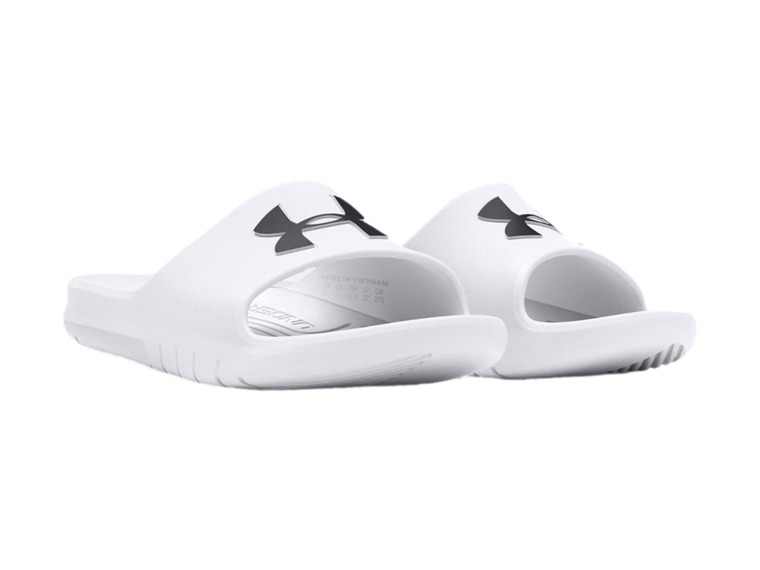 Sandalia Under Armour de color blanco con logo negro en la parte superior, diseño deportivo y suela ancha.