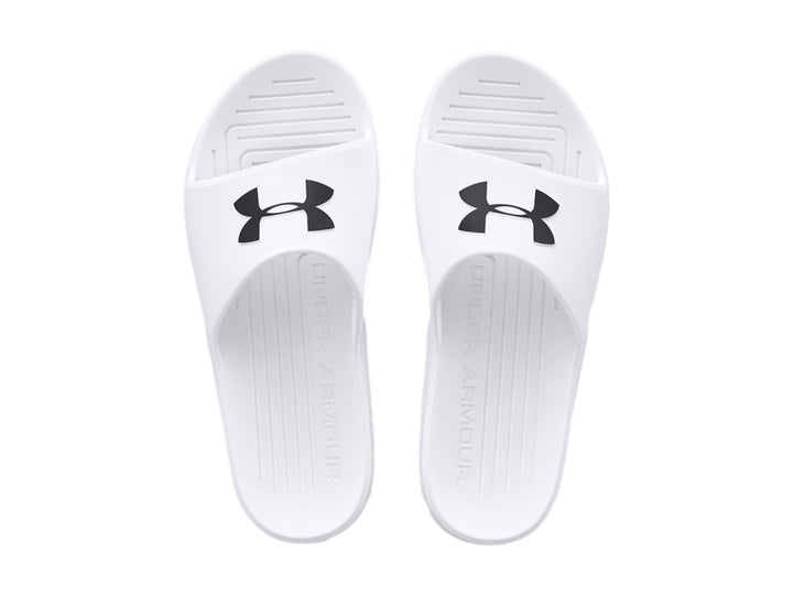 Sandalia Under Armour de color blanco con logo negro en la parte superior, diseño deportivo y suela ancha.