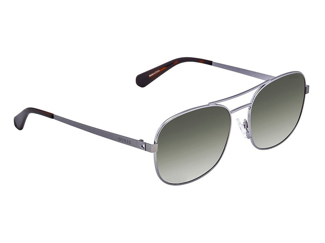 Lentes de sol Guess modelo 5201 06Q color gris con armazón metálico y micas degradadas estilo aviador.