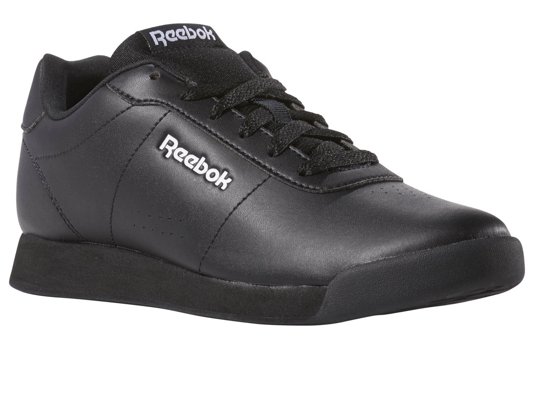Tenis Reebok Royal Charm para mujer en color negro con logotipo blanco lateral.