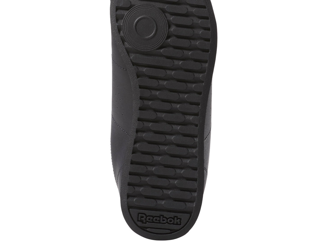 Tenis Reebok Royal Charm para mujer en color negro con logotipo blanco lateral.