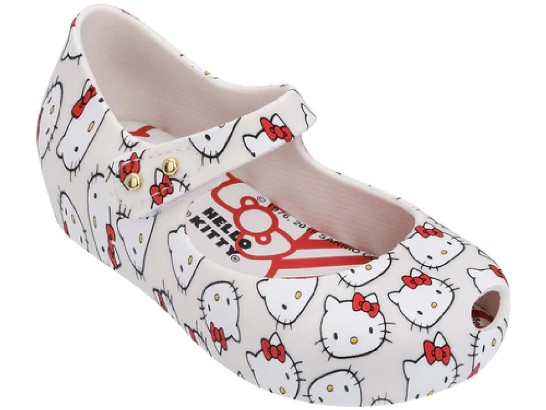Sandalia blanca Mini Melissa con estampado de Hello Kitty y correa con botón dorado.