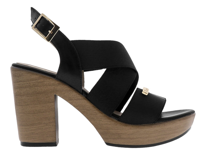 Sandalia Paulie color negro con plataforma y tacón en tono ébano, diseño de correas cruzadas y cierre con hebilla.