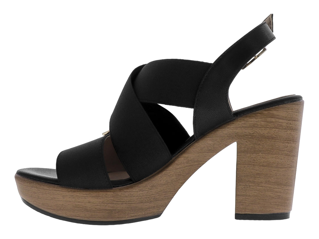 Sandalia Paulie color negro con plataforma y tacón en tono ébano, diseño de correas cruzadas y cierre con hebilla.