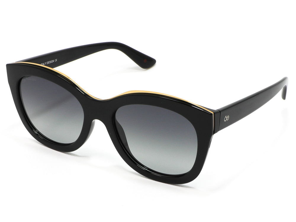 Lentes de sol Cloe para mujer en color negro con detalle dorado superior y micas degradadas.