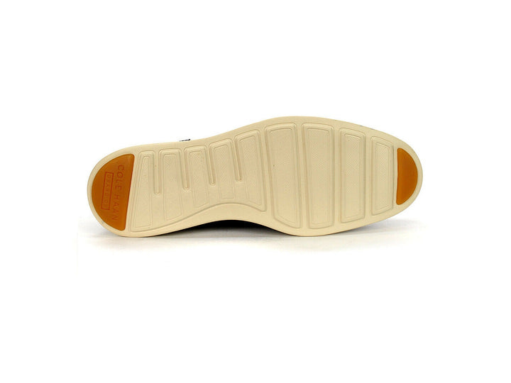 Zapato Oxford Cole Haan color navy con suela blanca para hombre.