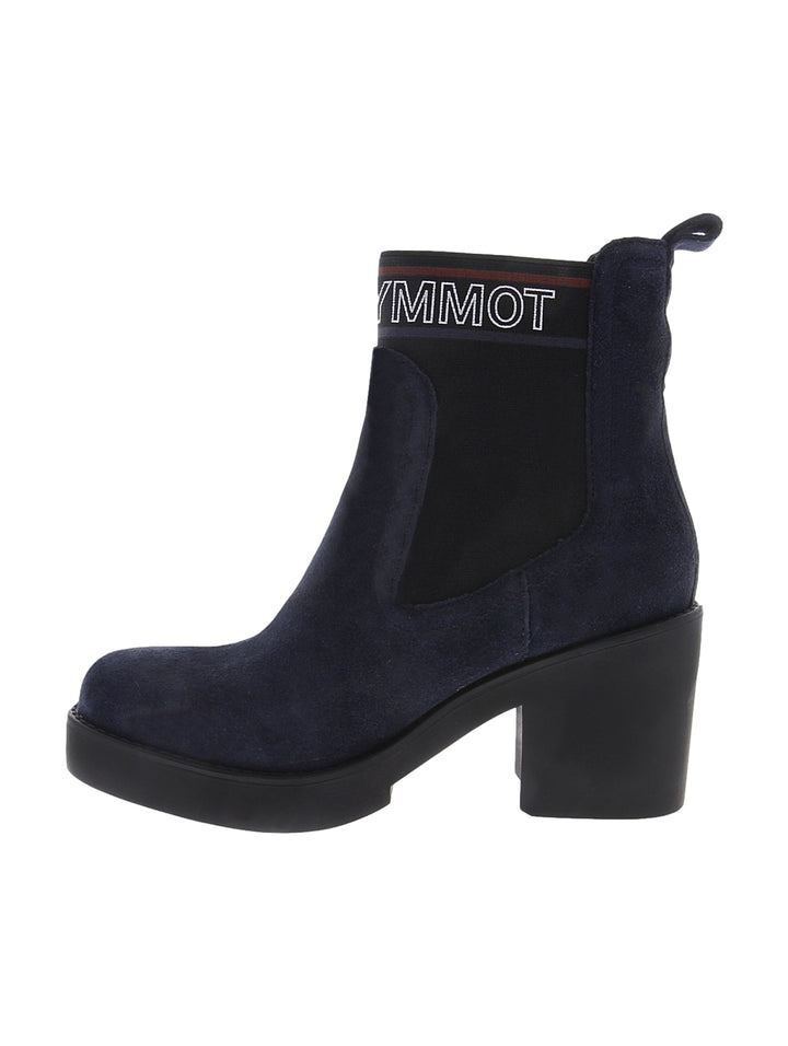 Botas Tommy Hilfiger de gamuza color azul marino con tacón cuadrado negro y detalle elástico lateral.